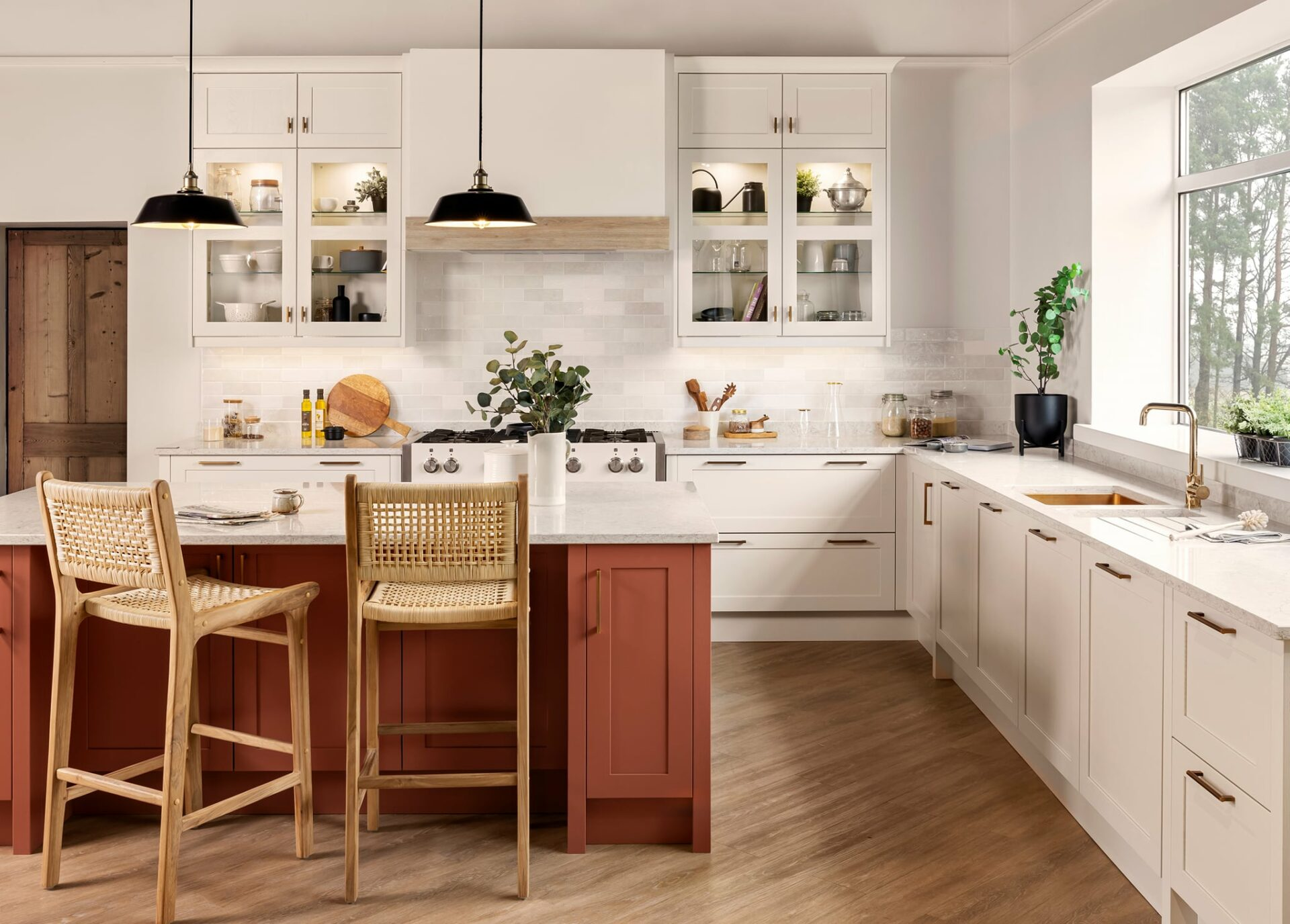 A cosy kitchen bathed in warm earthy tones with natural light streaming in